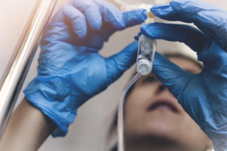 A medical professional preparing a sedation for dental procedure